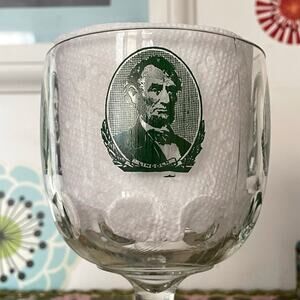 Vintage Abraham Lincoln Goblet Glass, 1970s Clear Thumbprint Barware Green Logo